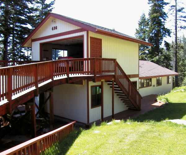 Entertain your guests at this Lake Tahoe vacation rental with 1000 feet of redwood deck, 8 person hot tub, custom built oak pool table, wood stove, views of Heavenly Ski Area and several mountain ranges and surrounded by fir trees.